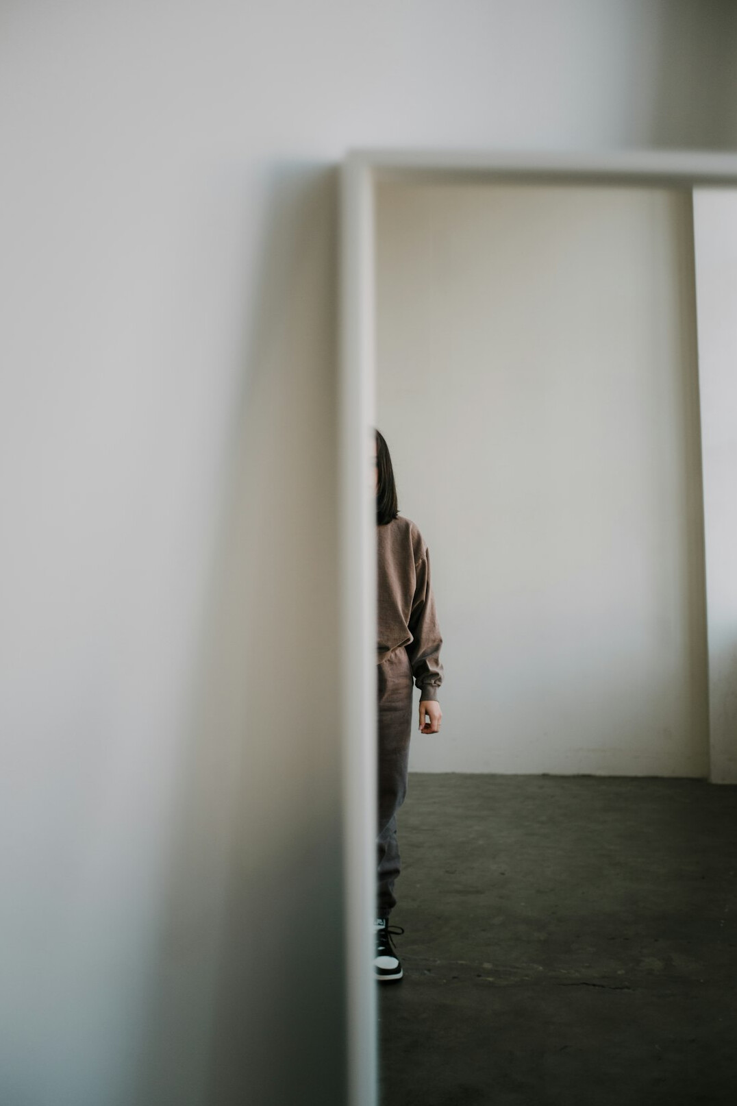 person standing confidently in mirror