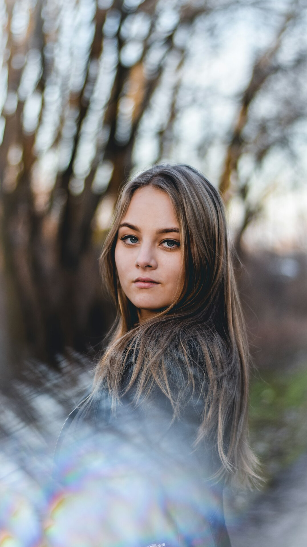 Portrait of a young woman with long hair