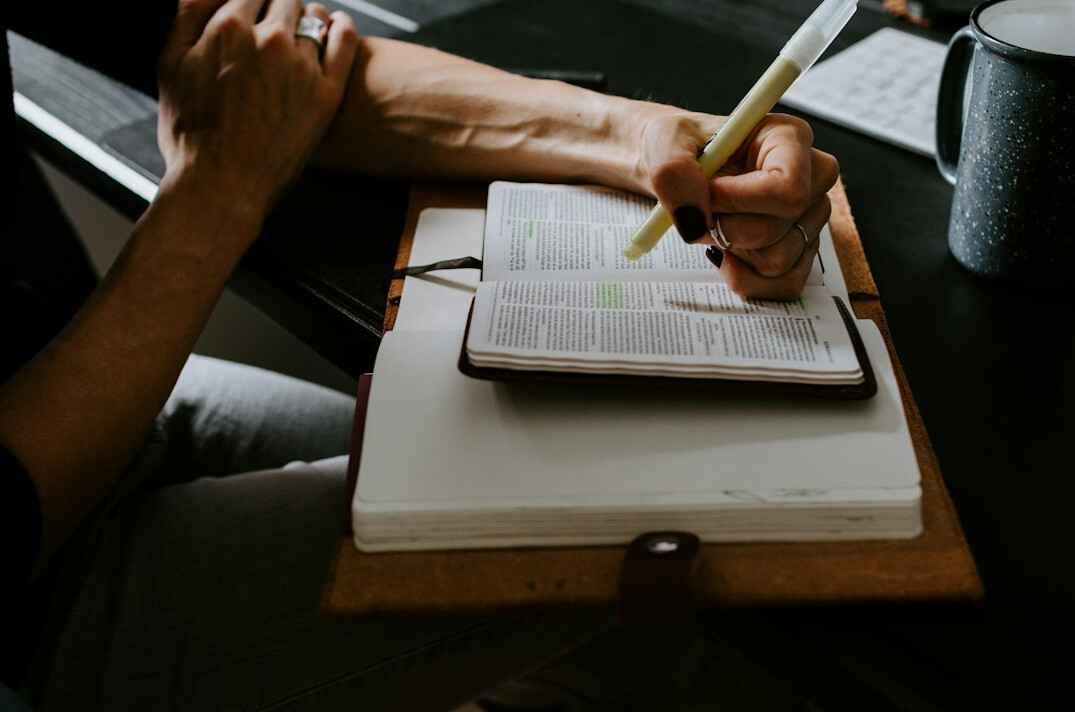 person journaling at desk